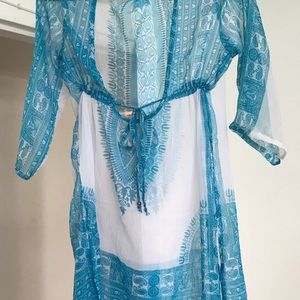 A blue and white cover-up to take to the beach